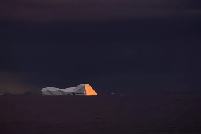 Framed Print : Last light in a stormy evening over an iceberg in Marguerite Bay, Antarctic Peninsula, Antarctica. March, 2023 Framed Print : Last light in a stormy evening over an iceberg in Marguerite Bay, Antarctic Peninsula, Antarctica. March, 2023