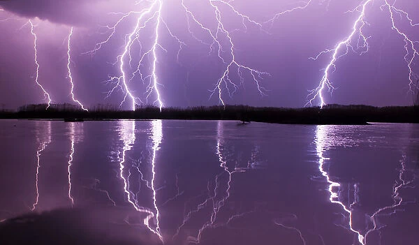 Lightning storm over Lake Csaj, Kiskunsagi National Park, Pusztaszer, Hungary. May 2012