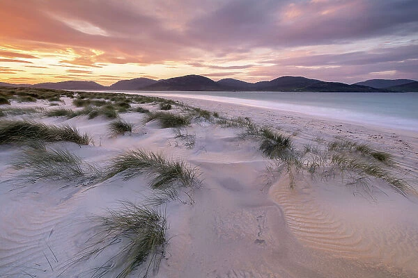 Luskentye beach at sunrise, mountains and incoming tide, Isle of Lewis and Harris, Outer Hebrides, Scotland, UK. October 2018