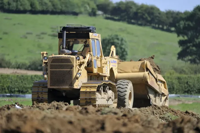 Framed Print : Machine creating earth embankment for lagoon at Rutland Water. Summer 2010