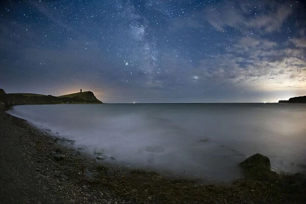 The Milky Way with Saturn and Jupiter in the night sky over Kimmeridge Bay
