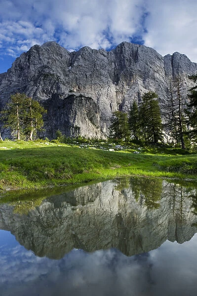 Mount Velika Mojstrovka (2, 056m) reflected in a pool, viewed from Sleme, Triglav National Park