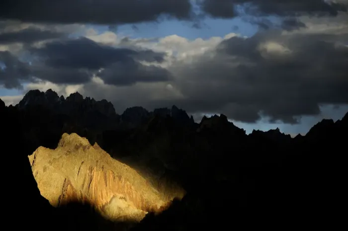 Framed Print : Mountain peaks and ridges in evening light, stormy skies above Framed Print : Mountain peaks and ridges in evening light, stormy skies above