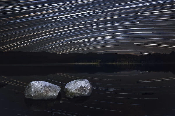 Night sky over Loch Morlich with star trails, Cairngorms National Park, Cairngorms