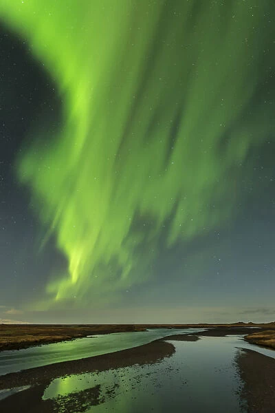 The Northern Lights  /  Aurora Borealis over a river, Vik, Iceland. February 2014
