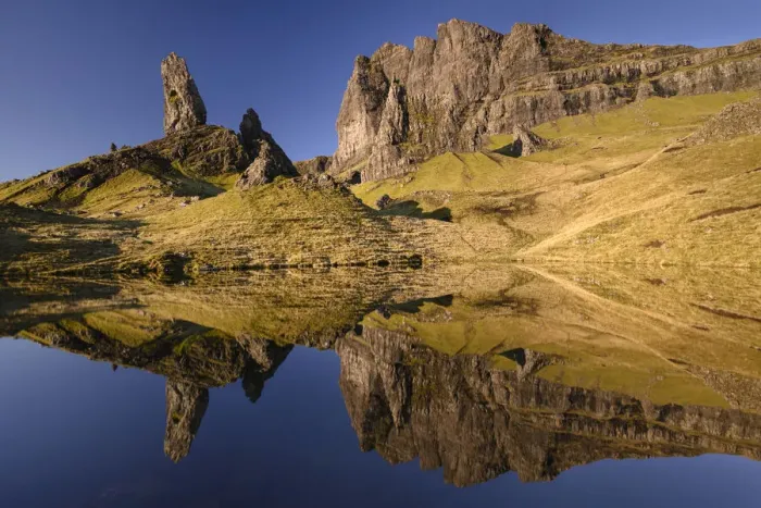 Framed Print : Old Man of Storr reflected in small lochan in morning light Framed Print : Old Man of Storr reflected in small lochan in morning light
