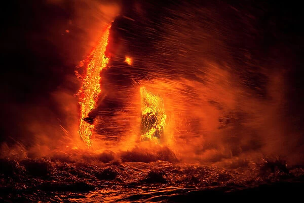 Pahoehoe lava flowing from Kilauea reaching Pacific Ocean near Kalapana, Big Island, Hawaii