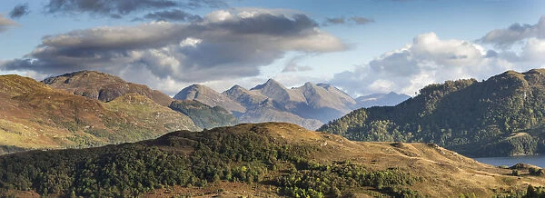 Partially wooded uplands with Five Sisters of Kintail in background, Northwest Highlands