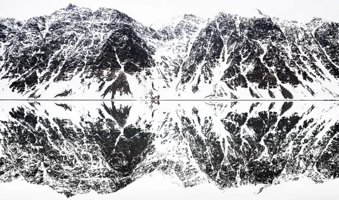 Framed Print : Perfectly mirrored landscape of snow covered mountains along the fjords in Svalbard Framed Print : Perfectly mirrored landscape of snow covered mountains along the fjords in Svalbard