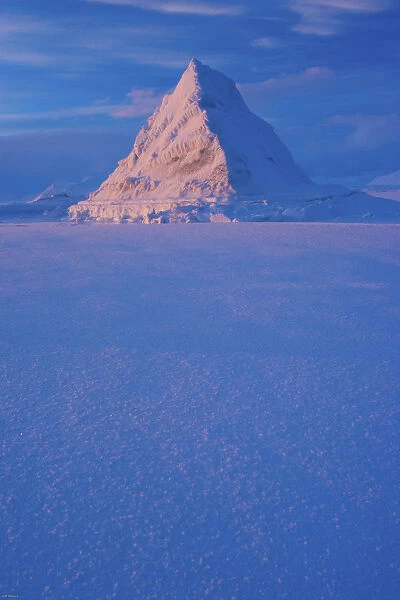 Pyramid of sea ice catching the first rays of the returning sun in the high Arctic