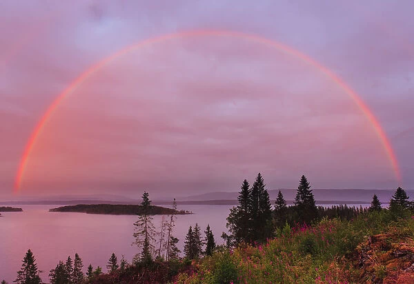 Rainbow over Snsavatnet, at dusk, Nord-Tronelag, Norway, July