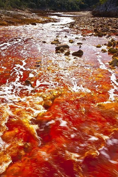 Red waters of the Rio Tinto, coloured by dissolved minerals, primarily iron. Andalusia