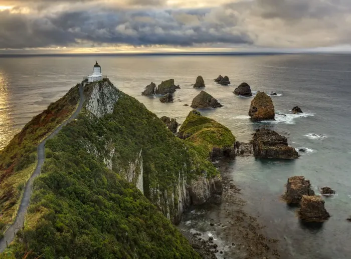 Framed Print : RF- Nugget Point (Ka Tokata) lighthouse at sunrise, rain clouds sweeping in from the horizon Framed Print : RF- Nugget Point (Ka Tokata) lighthouse at sunrise, rain clouds sweeping in from the horizon