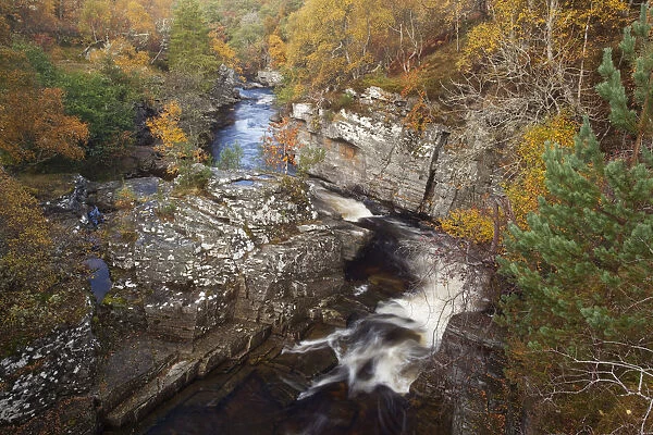 River Tromie flowing through a small gorge in autumn. Cairngorms, Scotland, October 2009