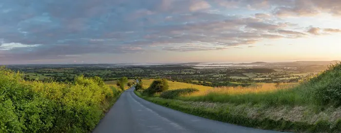 Framed Print : The road to Okeford Fitzpaine; dawn on Midsummers Day, in the Blackmore Vale, from Okeford Hill, Dorset, England, UK. June 2019 Framed Print : The road to Okeford Fitzpaine; dawn on Midsummers Day, in the Blackmore Vale, from Okeford Hill, Dorset, England, UK. June 2019