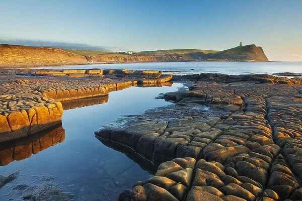 Rock formations at Kimmeridge Bay, Clavell Tower in background, Isle of Purbeck, Jurassic Coast
