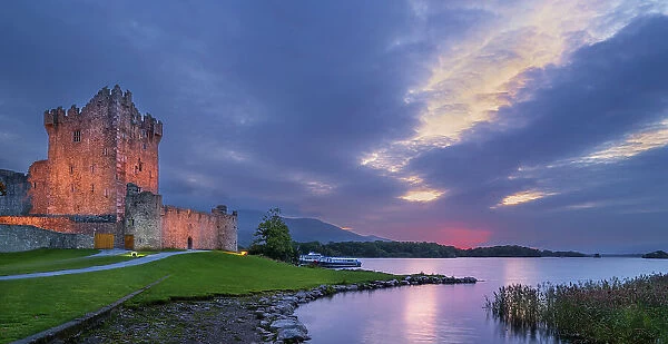 Ross Castle and Lough Leane at dusk, Killarney National Park, County Kerry, Republic of Ireland. September, 2022