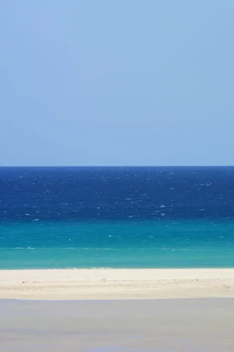 Framed Print : Sandy beach and bright blue ocean, Fuerteventura, Canary Islands. April 2013 Framed Print : Sandy beach and bright blue ocean, Fuerteventura, Canary Islands. April 2013