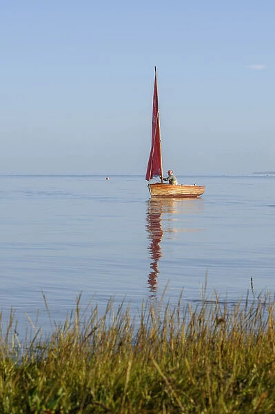 Small traditional sailing boat on the Thames Estuary, Two Tree Island, Essex, England