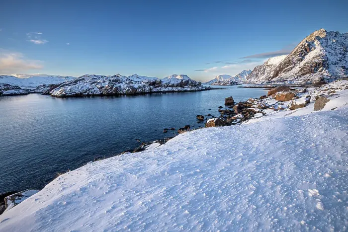 Framed Print : Snow over shore and mountains in winter, Henningvaer, Lofoten Islands, Norway. March, 2023 Framed Print : Snow over shore and mountains in winter, Henningvaer, Lofoten Islands, Norway. March, 2023