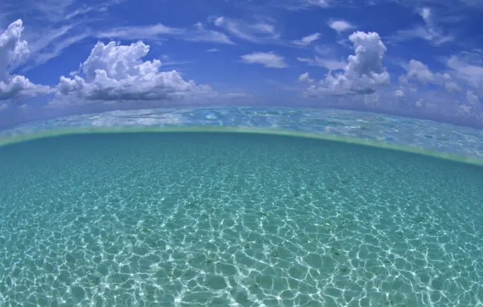 Framed Print : A split level view of shallow water and clouds in summer, Seven Mile Beach, Grand Cayman Framed Print : A split level view of shallow water and clouds in summer, Seven Mile Beach, Grand Cayman