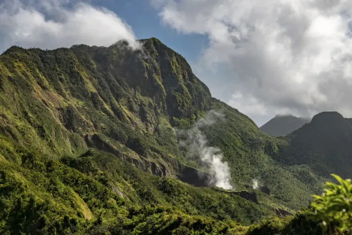 Framed Print : Steam rising from Boiling Lake, a sulphur lake surrounded by cloud forest on active Framed Print : Steam rising from Boiling Lake, a sulphur lake surrounded by cloud forest on active