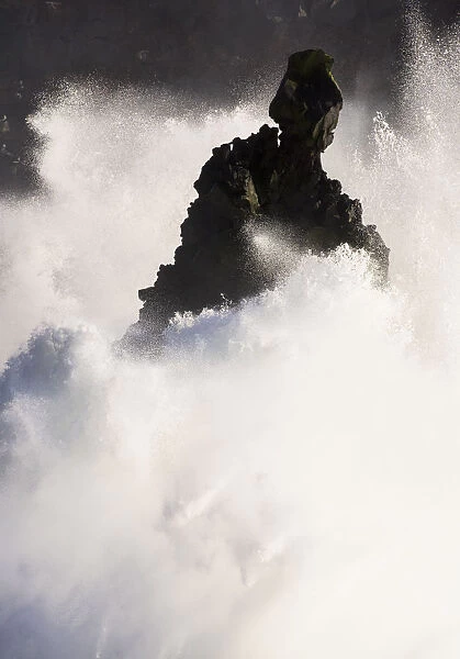 Storm waves breaking against cliffs at Svortuloft, Iceland April 2016