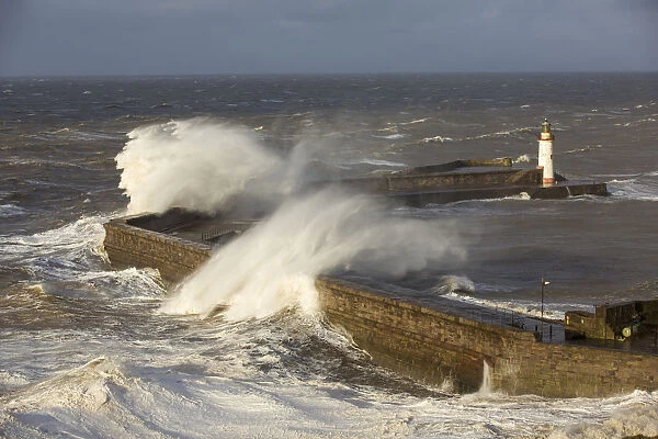 Storm waves from an extreme low pressure system batter Whitehaven harbour, Cumbria