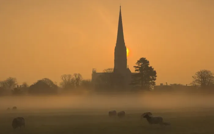 Framed Print : Sun rising through mist behind Salisbury Cathedral viewed across Harnham Water Meadows Framed Print : Sun rising through mist behind Salisbury Cathedral viewed across Harnham Water Meadows