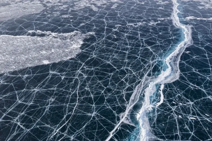 Framed Print : Transparent black ice with cracks on Lake Baikal, aerial shot Framed Print : Transparent black ice with cracks on Lake Baikal, aerial shot