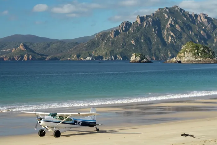 Framed Print : Transport plane on the beach runway of Codfish Island with the Ruggedy Range of Stewart Island in the background, Whenua Hou / Codfish Island, New Zealand. April, 2019 Framed Print : Transport plane on the beach runway of Codfish Island with the Ruggedy Range of Stewart Island in the background, Whenua Hou / Codfish Island, New Zealand. April, 2019