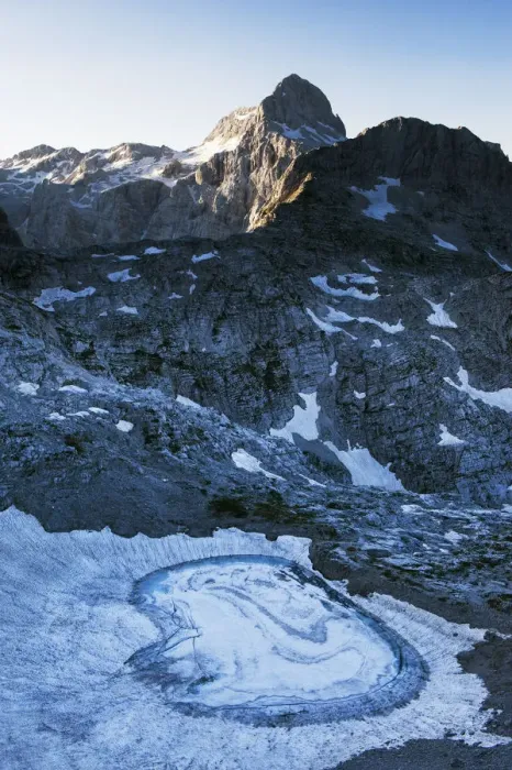 Framed Print : Upper Kriz Lake with ice melting, Mount Triglav (2, 864m) in the distance, Triglav National Park Framed Print : Upper Kriz Lake with ice melting, Mount Triglav (2, 864m) in the distance, Triglav National Park