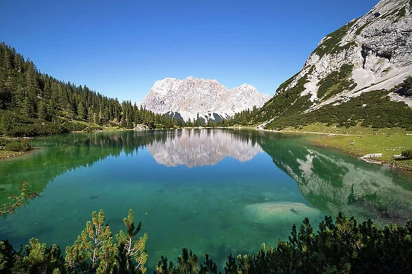 View over Lake Seebensee with Zugspitze and Wetterstein mountains in background, Alps, Tirol, Austria. September, 2020