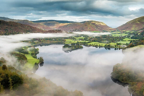 View from Loughrigg, with autumn colour and morning mist over Grasmere, The Lake District, Cumbria, UK. October 2012