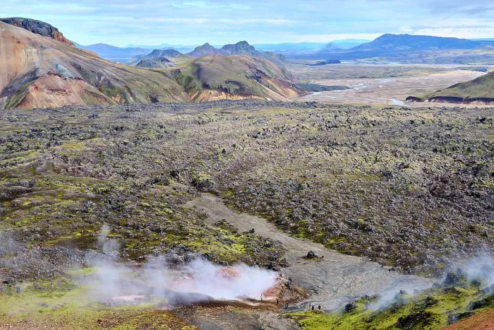 Framed Print : View of rhyolite mountains and solidified lava fields with steam from geothermal vents, Landmannalaugar volcanic massif, Fjallabak Nature Reserve, Iceland. September, 2023 Framed Print : View of rhyolite mountains and solidified lava fields with steam from geothermal vents, Landmannalaugar volcanic massif, Fjallabak Nature Reserve, Iceland. September, 2023