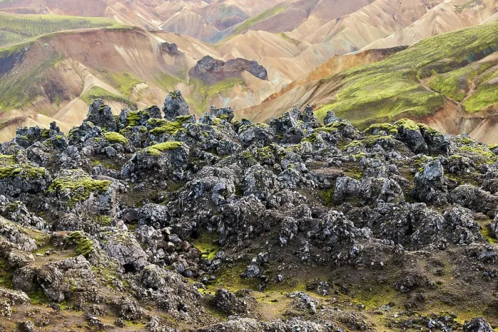 Framed Print : View of solidified lava fields with rhyolite mountains in background, Landmannalaugar volcanic massif, Fjallabak Nature Reserve, Iceland. September, 2023 Framed Print : View of solidified lava fields with rhyolite mountains in background, Landmannalaugar volcanic massif, Fjallabak Nature Reserve, Iceland. September, 2023