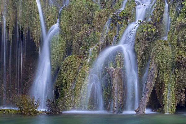 Water cascading over naturally formed tufa dam