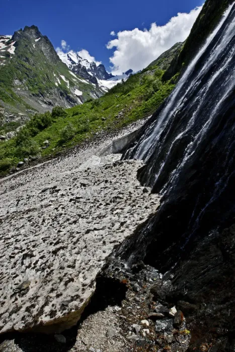 Framed Print : Water flowing down a rock face and underneath a glacier, Amanauz Valley near Dombay Framed Print : Water flowing down a rock face and underneath a glacier, Amanauz Valley near Dombay