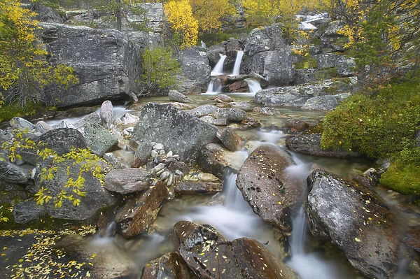 Waterfall cascading through rocky gorge in autumn, Stor-Elvdal, near Rondane National Park