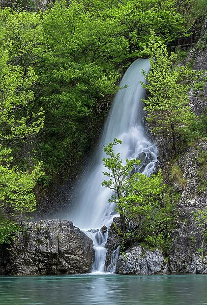 Waterfall flowing onto the Aoos River in Konitsa gorge, Epirus region, Greece. May, 2022