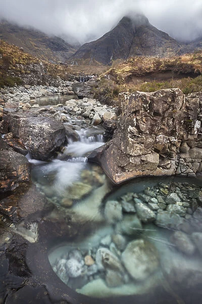 Waterfalls along the course of the Allt Coir a Mhadaidh river as it cascades