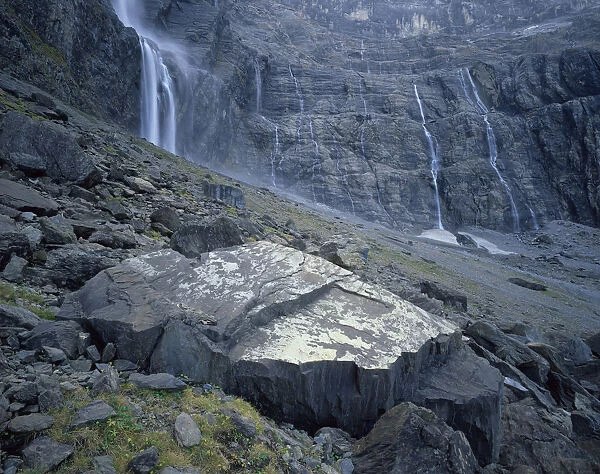 Waterfalls flowing down rock faces in the Cirque de Gavarnie, Pyrenees, France, October