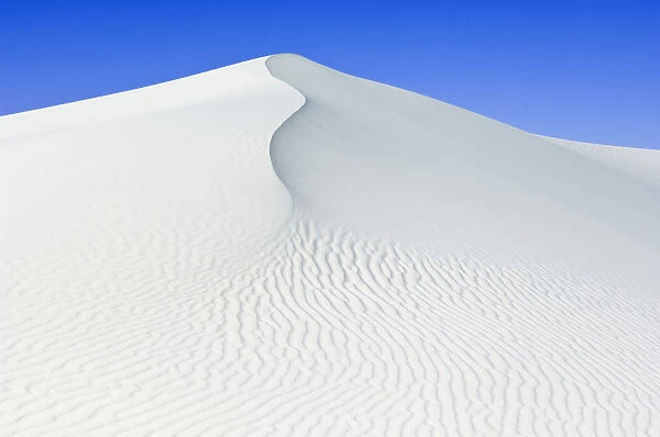 White sand dunes against blue sky, White Sands National Monument, New Mexico, USA, February 2009