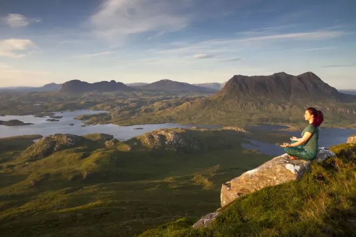 Framed Print : Woman meditating on Stac Pollaidh mountain with views of surrounding lochs and mountains, Assynt, Scotland, UK. July, 2017 Framed Print : Woman meditating on Stac Pollaidh mountain with views of surrounding lochs and mountains, Assynt, Scotland, UK. July, 2017