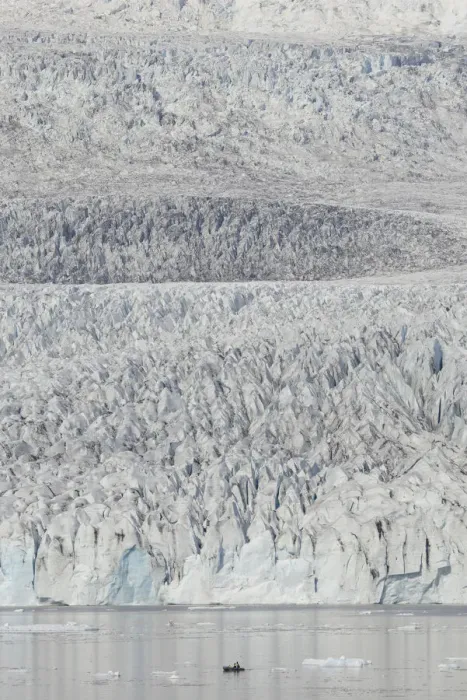 Framed Print : Zodiac carrying visitors navigating among ice floes at foot of Fjallsarlon Glacier, Iceland. July Framed Print : Zodiac carrying visitors navigating among ice floes at foot of Fjallsarlon Glacier, Iceland. July