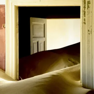 Abandoned house full of sand. Kolmanskop Ghost Town, an old diamond-mining town where Abandoned house full of sand. Kolmanskop Ghost Town, an old diamond-mining town where