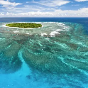 Aerial panorama of Fangasito Island with the underwater coral reef clearly visible, Vava'u island group, Kingdom of Tonga, South Pacific, with Fonua'one'one island visible in the background. September 2019 Aerial panorama of Fangasito Island with the underwater coral reef clearly visible, Vava'u island group, Kingdom of Tonga, South Pacific, with Fonua'one'one island visible in the background. September 2019