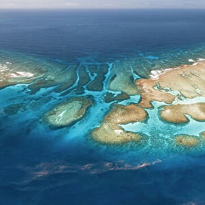 Aerial panorama of Maninita Island which sits atop an extensive coral reef structure, which is for the most part not visible from the surface of the ocean. The reefs extend into the smaller island of Fonuafo'ou in the background