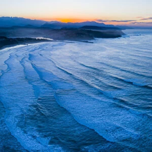 Aerial view of Gerra beach and sea at twilight, Oyambre Natural Park