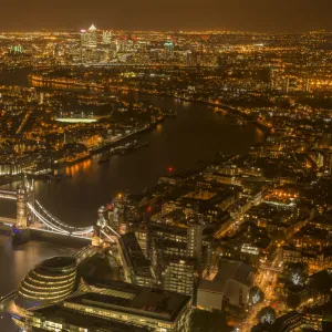 Aerial view of River Thames and Tower Bridge in London at night. October 2014